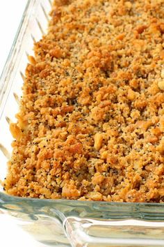 a casserole dish is filled with meat and crumbled bread toppings