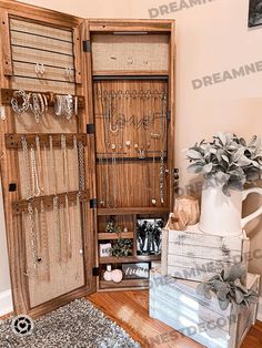 a wooden cabinet filled with lots of jewelry