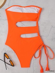 Eromis - Tangerine Cut Out Tassel One Piece Swimsuit: Bandeau Style with Tie-Side Detail, Premium Stretch Fabric, Elegant Solid Color - Womens Swimwear & Clothing Strapless Beachwear Bodysuit For Beach, Strapless Solid Color Bodysuit For Beach, Solid Bandeau Bodysuit For Beach, Orange Strapless Swimwear For Swimming, Orange Beachwear Bodysuit For Beach, Summer Strapless Bodysuit For Beach, Orange Sleeveless One Piece For Pool, Sleeveless Orange One Piece For Pool, Orange Summer One-piece For Pool