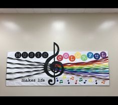 the wall is decorated with colorful music notes and musical instruments on it's side