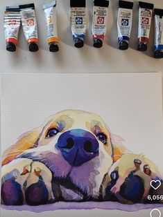 a painting of a dog with his paws on the ground next to some paint tubes