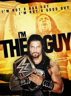 the wrestler is holding his wrestling belt in front of an advertisement for wwe's i'm the guy