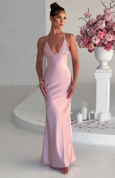 The sleek, sexy lines of Miriam in blush make it the perfect choice for the most special occasions. Crafted from our premium bias cut satin that skims over the figure, this design drapes beautifully at the skirt and skims the floor with a maxi length. The look is is finished with a plunge neckline and pretty pleated cups. Blush Classy Bridesmaid Dresses, Beautiful Blush Bridesmaid Dresses, Elegant Bridesmaids Dresses Blush, Blush Halter Wedding Dress, Homecoming Dresses Corset, Midi Dress Wedding Guest, Maxi Dress Sale, Prom Dress Inspiration, Sparkle Dress