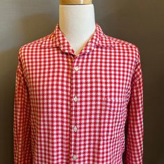 "You are viewing a very cool Vintage Men's Cotton Gingham Shirt by Structure c1990s. This great looking shirt is made of a distinctive woven red + white gingham cotton fabric. Details include camp collar, 6 button placket (with pearlized plastic buttons), patched left chest pocket, slight drop shoulders, double buttoned sleeve cuffs (with a smaller button up the sleeve) and slightly curved hem at waist (a tad longer in back). Dates from likely the early-to-mid 1990s. Retains maker's label at nec Red Shirt For Summer Daywear, Red Summer Shirt For Daywear, Red Summer Daywear Shirt, Long Sleeve Cotton Shirt With Houndstooth Pattern, Casual Gingham Shirt For Daywear, Cotton Collared Top With Houndstooth Pattern, Classic Red Shirt For Daywear, Gingham Relaxed Fit Collared Shirt, Relaxed Fit Gingham Collared Shirt