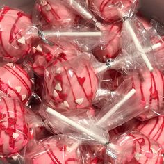 there are many candy lollipops wrapped in plastic