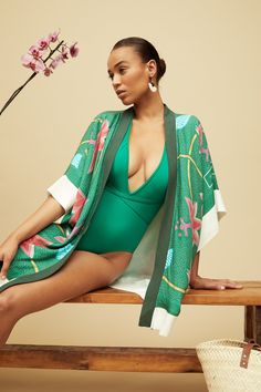 Elegant and striking, our Dhana Kimono is the perfect layer for summer days and effortless style. Throw it over a dress, jeans, or even a swimsuit, wear it on a night out, at the beach, or in the comfort of your home. The print on our Kimono is inspired by traditional Kanga textiles and is digitally printed. Made from 100% Rayon, a natural fibre, this Kimono is One Size and it is made in South Africa. We collaborated with a few local brands based in South Africa to create these special looks: Qi Printed Summer Cover-up For Day Out, Summer Beach Cover-up Kimono, Chic Spring Unlined Cover-up, Chic Unlined Spring Cover-up, Green Beachwear Cover-up For Spring, Chic V-neck Summer Kimono, Spring Tropical Print Cover-up For Poolside, Printed Summer Poolside Cover-up, Summer Tropical Print Poolside Cover-up