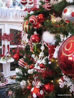 a christmas tree decorated with red and white ornaments