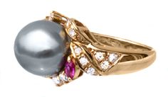 This is a beautiful, large 11 mm Tahitian Platinum Pearl, Diamond & Ruby ring from our vintage collection. It would be a stunning addition to your jewelry wardrobe. The setting is almost a 'bypass' setting design, with 2 lovely natural rubies and diamonds accenting the pearl, all in 18K yellow gold. A question we're asked often - Does it in person look like the photographs? Yes! Even better - we photograph in sunlight, but the sparkle is truly impossible to catch on camera. Setting: 18K soli Elegant Yellow Gold Multi-stone Pearl Ring, Elegant Multi-stone Gold Pearl Ring, Elegant Yellow Gold Tahitian Pearl Jewelry, Formal Yellow Gold Multi-stone Pearl Ring, Classic Multi-stone Pearl Ring For Formal Occasions, Gold Tahitian Pearl Rings For Wedding, Elegant Formal Rings With High Luster, Elegant Formal Multi-stone Pearl Ring, Elegant High Luster Rings For Formal Occasions