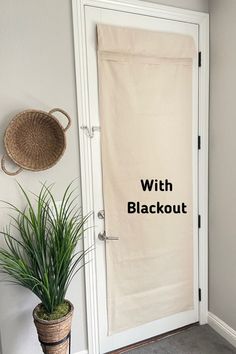 a white door with the words with blackout on it next to a potted plant