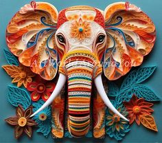 an elephant made out of paper with flowers and leaves on it's head, sitting in front of a blue background