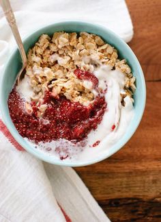 a bowl filled with oatmeal sitting on top of a table