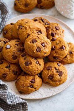 a plate full of chocolate chip cookies on a table