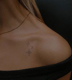 a woman with a cross tattoo on her chest