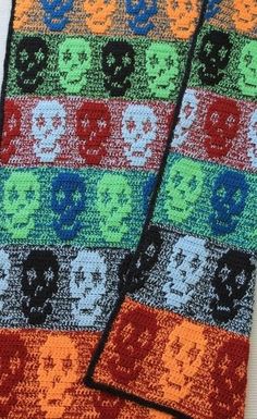 a knitted scarf with skulls on it