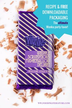 a bar of chocolate with purple and white stripes on it, surrounded by chopped wood shavings