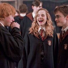 three young harry potters are laughing and standing in front of each other at the same time