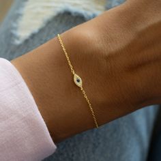 Dainty & minimalist evil eye bracelet is great for stacking or on it's own! Evil Eye is said to serve as protection and bring in only good energy! Great gift idea or as a friendship bracelet! Thick plating of 14k Gold or Rhodium plated over 925 Sterling Silver Two sizes available: 6.25" or 6.75" + .5" Extension 4mm Evil Eye Charm Lobster Clasp Closure Nickel-free and Hypoallergenic Highest Grade CZ stones for an authentic look Evil Eye Bracelet Silver, Rice Bead Bracelet, Bracelet Tennis, Rice Bead, Protection Bracelet, Classy Jewelry, Eye Bracelet, Dainty Bracelets, Evil Eye Charm