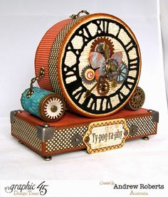 an ornate clock is sitting on top of a box