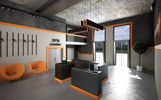 an office with orange and black accents in the middle of the room is empty except for two chairs