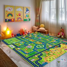 a child's play area with toys and lights on the floor in front of windows