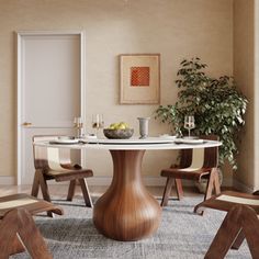 a dining room table with chairs around it