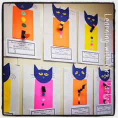 several pieces of paper that have been made to look like cats with different colors and shapes