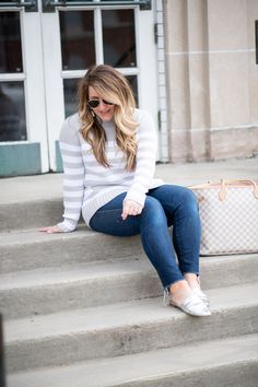 J.Crew Jeans Featured by top US fashion blog Coffee Beans and Bobby Pins; Image of a woman wearing J.Crew jeans, Ray Ban sunglasses, J.Crew sweater, DSW shoes and Sugarfix earrings from Target.