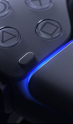 a close up view of the buttons on a computer keyboard with blue light coming from it