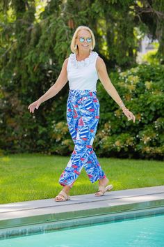 Discover the casual confidence of American tailoring with our Dorothy pants. These flowy, easy to wear pants are sandal length and ideal for pairing with sold separately coordinates. This selection is created with a nautical red, white, and blue pattern in our nylon blend fabric. The pants include moisture wicking management, UPF 50+ sun defense, and a detachable sash. Model is 5’7 and wearing a size small. Fabric Fabric is 90% Nylon and 10% Spandex, and is finished with Vaportex moisture manage White And Blue Pattern, Blue Pattern, Red White And Blue, Red White Blue, Upf 50, Defense, White Blue, Moisture Wicking, Harem Pants