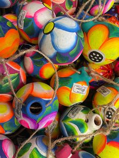 many brightly colored balls are tied up together