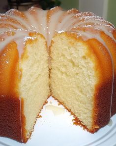 a bundt cake with white icing on a plate