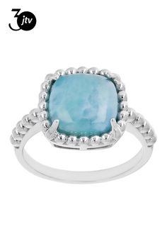 a ring with a blue stone in the center