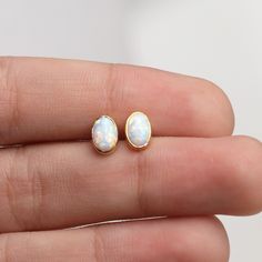 14k Gold Opal Stud Earrings,Dainty Earrings,White Opal Earrings.Minimalist Errings,Real Opal Earrings  ❤️Minimalist look and dainty design❤️ ABOUT PRODUCTS; Handmade with 14k Gold,925 Solid Sterling Silver We have color options. Silver Gold Rose gold Comes with a stylish gift-ready elegant jewelry box ** ANY PROBLEMS AND PLEASE CONTACT ME IN ORDER CONTENT, THANK YOU ** Dainty Opal Earrings, Dainty Opal Jewelry, White Stud Earrings, Opal Earrings Dangle, Opal Jewelry Earrings, Opal Earring, White Opal Earrings, Gold Bead Earrings, Opal Stud Earrings