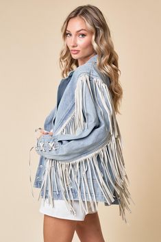 Introducing our Buckle Up Fringed Denim Jacket! Elevate your denim game with this edgy and stylish piece. Featuring fringe details and buckle accents, this jacket adds a touch of flair to any outfit. Edgy and stylish denim jacket with fringe details and buckle accents Versatile piece that can be dressed up or down for any occasion Made from high-quality denim for durability and comfort Perfect for adding a touch of flair to your everyday look Trendy Denim Jacket With Fringe, Chic Denim Outerwear With Frayed Hem, Chic Fall Denim Jacket With Frayed Hem, Trendy Fringe Denim Jacket, Casual Medium Wash Denim Jacket With Fringe, Chic Distressed Denim Jacket For Fall, Trendy Long Sleeve Denim Jacket With Fringe, Casual Fringe Denim Jacket For Spring, Trendy Medium Wash Denim Jacket With Fringe