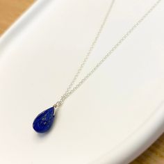 Raw lapis lazuli gemstone necklace. A Genuine Lapis Lazuli Pendant to weaer as a layered necklace or lapis Lazuli choker. ✔️Genuine Lapis Lazuli Necklace✔️ High-Quality  925 Sterling Silver Available with a  24K Gold  Finish This Blue Lapis necklace is a great jewelry gift. It is the perfect gift for your girlfriend, sister, bridesmaids, or even yourself! Made by hand in Greece.     👉A few words about Genuine Lapis Lazuli. Lapis Lazuli is one of the most sought-after stones. Its deep, celestial Blue Sterling Silver Drop Necklace As A Gift, Blue Sterling Silver Drop Necklace For Gift, Blue Teardrop Pendant Minimalist Jewelry, Sapphire Drop Necklaces For Gifts, Sapphire Drop Necklace For Gift, Blue Minimalist Teardrop Pendant Jewelry, Minimalist Blue Teardrop Pendant Jewelry, Blue Teardrop Spiritual Jewelry, Lapis Lazuli Gemstone Beads Necklace For Gift