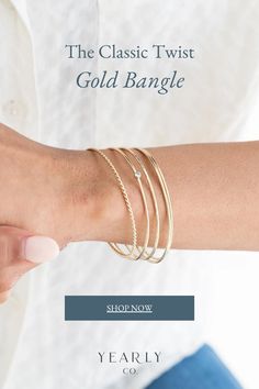 A bangle made from two 14k gold wires twisted together. A beautiful addition to a bangle stack to represent a special year, event, or relationship. Shop now and add to your stack! Timeless Gold Bangle With Polished Finish, Gold Bangle With A Modern Twist, Ceremonial Polished Gold Bangle, Modern Twist Yellow Gold Bangle Bracelet, Modern Twist Bangle With Polished Finish, Bangle Stack, Twisted Bangle, Bangles Making, Gold Hand