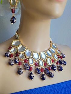 FREE SHIPPING ALL OVER USA SAME DAY SHIPPING for order 1 am to 1 pm . 3- 5 days delivery by USPS. USA Saller 🇺🇸.  New 2023 designer uncut kundan necklace with matching delicate a pair of earrings. Pristine quality and craftsmanship Indian Bridal Traditional 1.5 Gram 24K gold plated Jewelry Necklace Set. back side modern long lasting quality oil painted meenakari art work.  The base metal color is Gold tone studded with brass uncut kundan along with thai hydro and onyx beads work on it. All the Blue Kundan Sets With Mirror Work, Festive Jewelry Sets With Gota Work As Gift, Festive Gota Work Jewelry Sets As A Gift, Blue Kundan Sets For Diwali, Handmade Kundan Sets For Festive Occasions, Kundan Jewelry With Mirror Work For Navratri, Party Jewelry Sets In Kundan With Meenakari, Festive Kundan Necklace With Mirror Work For Puja, Party Jewelry Sets In Meenakari Kundan