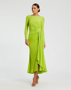 Crafted from high-quality jersey fabric, this dress features a high neckline, long sleeves, and ruched detailing that adds a touch of elegance. Perfect for any occasion, this dress is a must-have in any wardrobe. Ieena for Mac Duggal Jersey fabric (100% polyester)  Fully lined High neckline Long sleeves Ruched detailing  Asymmetrical bottom hem Concealed back zipper Approx. 48" from top of shoulder to bottom hem  Available in Chartreuse Style #27358 Chartreuse Midi Dress, Womens Dress Coats, Charmeuse Dress, Elegant Maxi Dress, Long Sleeve Gown, Daytime Dresses, Mac Duggal, Tea Length Dresses, Ruffle Hem Dress