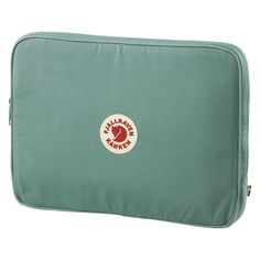 a green bag with a red and white logo on it