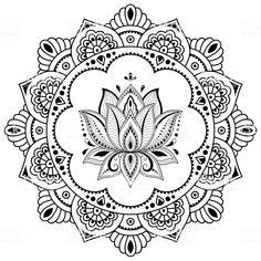 a black and white circular ornament with an intricate flower design on the center