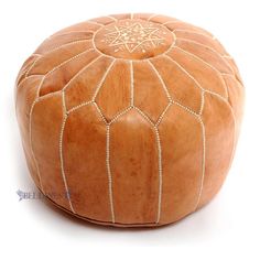 an orange colored round shaped object with white lines on the top and bottom, sitting in front of a white background