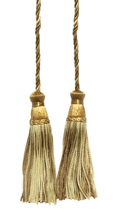 two gold tassels with rope ends