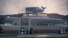 an old diner with a whale on the roof