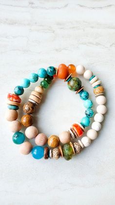 Western flair combination. orange, White, aqua, beige, green and turquoise blue. Will be beautiful with white and with a tan. Approx 15" in length and should fit wrists 7" to 7.5" nicely. Mixed gemstone wrap bracelet of Carnelian, Turquoise, Howlite, Jasper, Riverstone, White Turquoise, and Spiny Oyster Shell. Several raw rosewood beads for diffusing your favorite essential oils, 6mm, 8mm, or 10mm.  Similar sized coconut disks separate gemstones and add interest. Heavy duty elastic cord. One-of- Travel Bracelet, Gemstone Wrap Bracelet, Handmade Jewelry Tutorials, Turquoise Howlite, Bleu Turquoise, White Turquoise, Spiny Oyster, Bone Beads, Oyster Shell