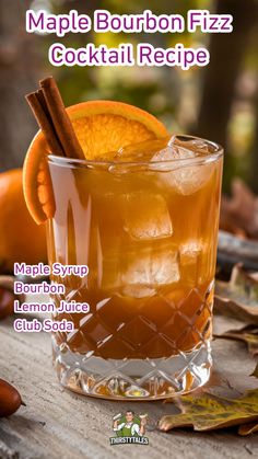 the maple bourbon fizz cocktail is served in a glass with an orange slice and cinnamon