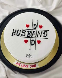 a cake with the words husband and i love you written on it in black lettering