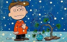 a charlie brown christmas card with snow falling on the ground and a small tree in front of him