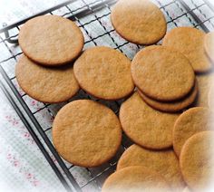 a bunch of cookies that are on a cooling rack