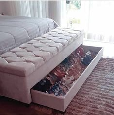 a bed that has some shoes in it