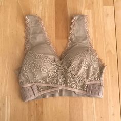 Nwt Beige Bra/Bralette. No Tags, But It Fits Me And I’m A Medium. I Got Two But I Only Need One, So This One Has Never Been Worn! Only Removed From Packaging To Photograph. You Put It On My Slipping It Over Your Head, And The The Crossover Clasps On The Front Provide Extra Support And Lift. Size: No Size, But Fits A Medium (I’m A 36b And It Fits Me, For Reference). Please Feel Free To Bundle And/Or Make An Offer! Your Head, Crossover, Women's Intimates, Bralette, Packaging, Feel Free, Bra, Cream, Tags